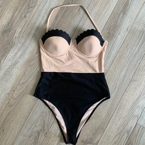 Tan and black one piece swimsuit